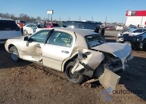 2001 Lincoln Town Car Cartier z USA, uszkodzony, nr VIN 1LNHM83W81Y706833